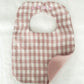 Babies pink check reversible bib