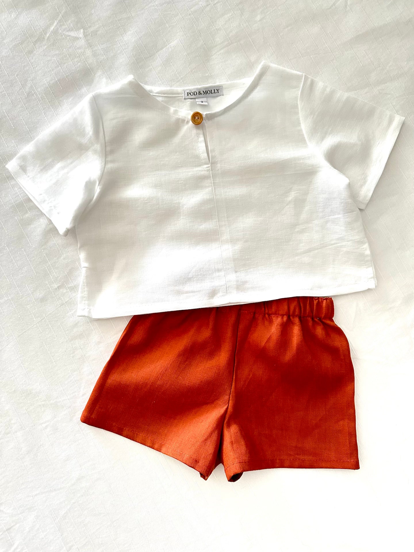 Ollie white boys top and Paprika George shorts