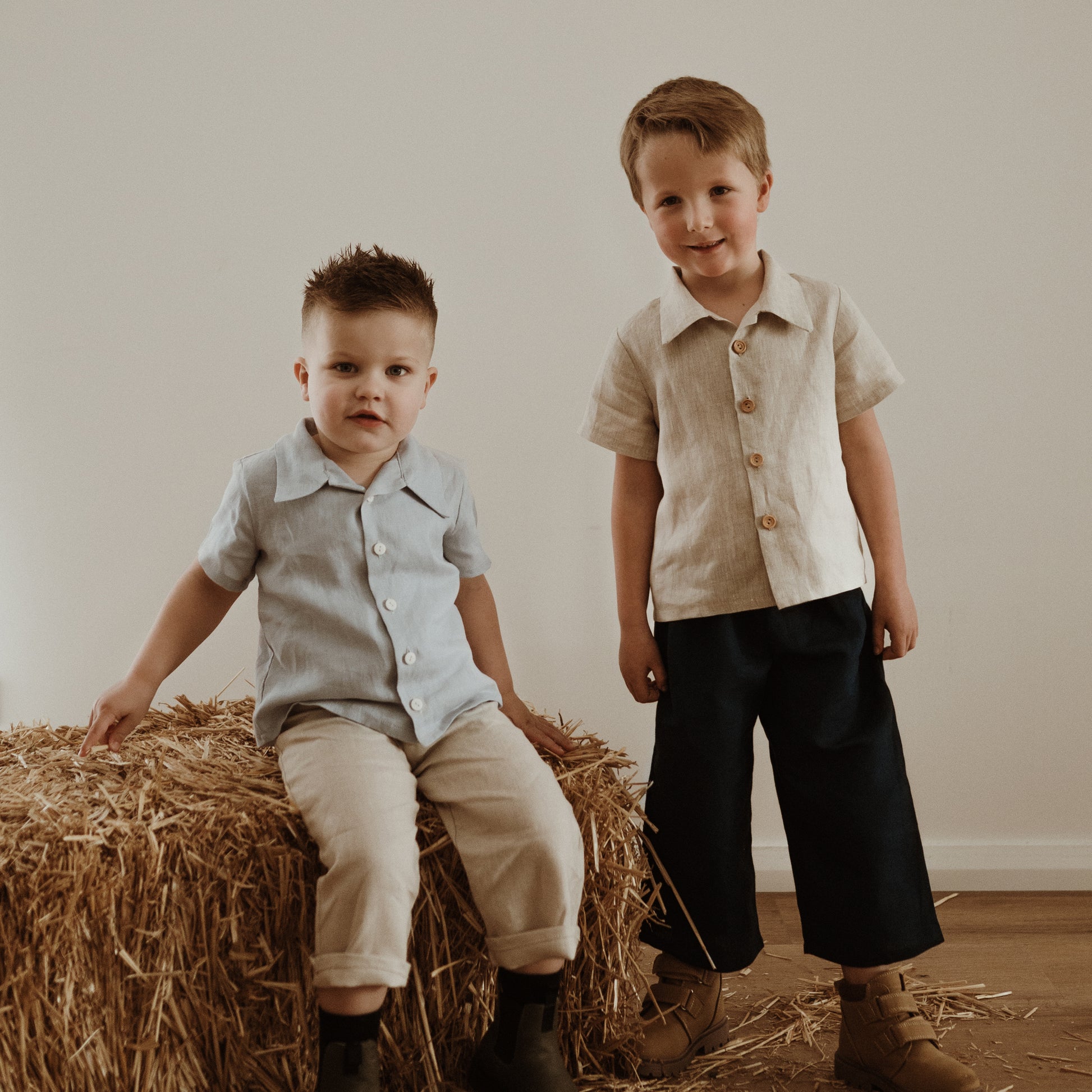 Two boys wearing the Charlie button up shirt