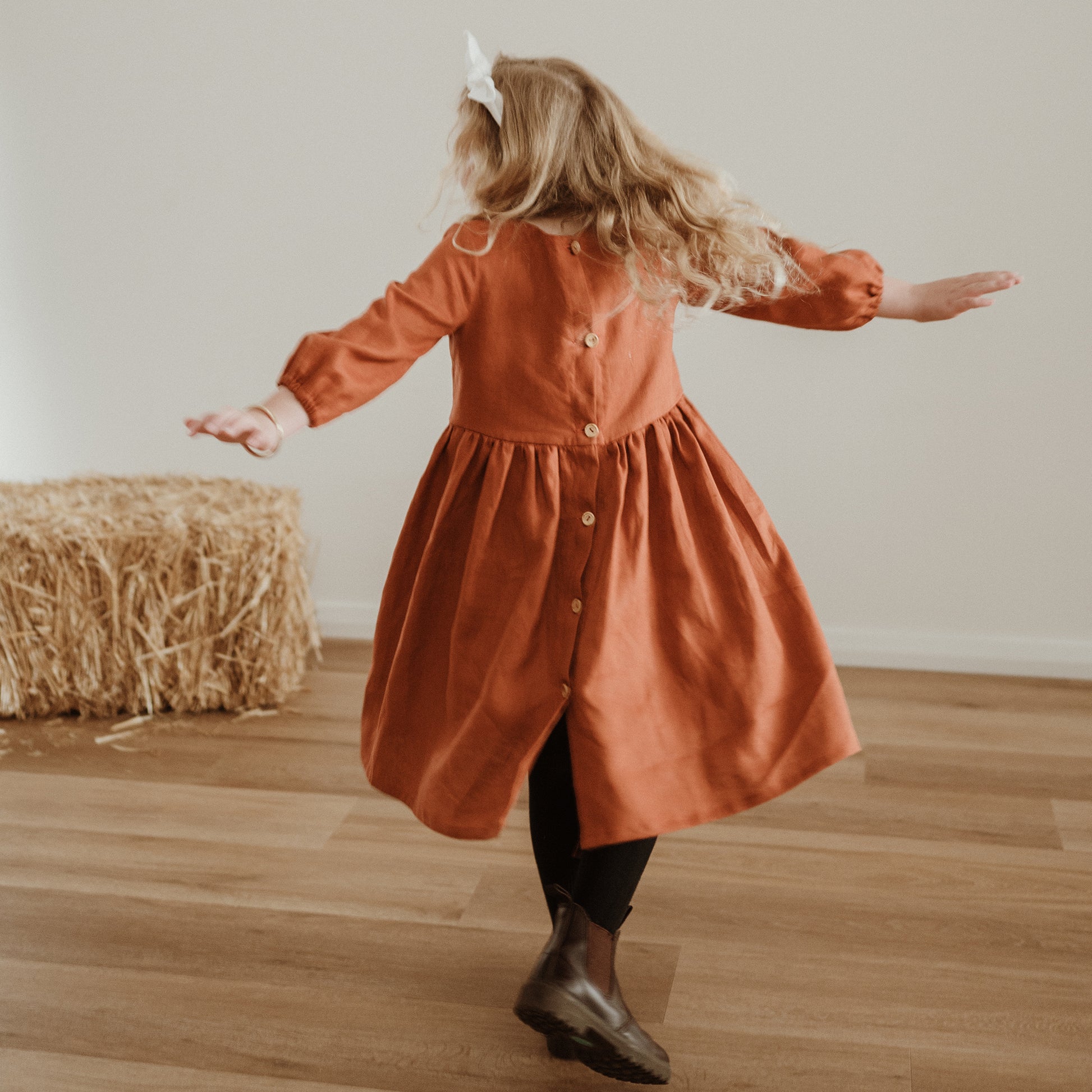 Girl swirling in Sophie dress